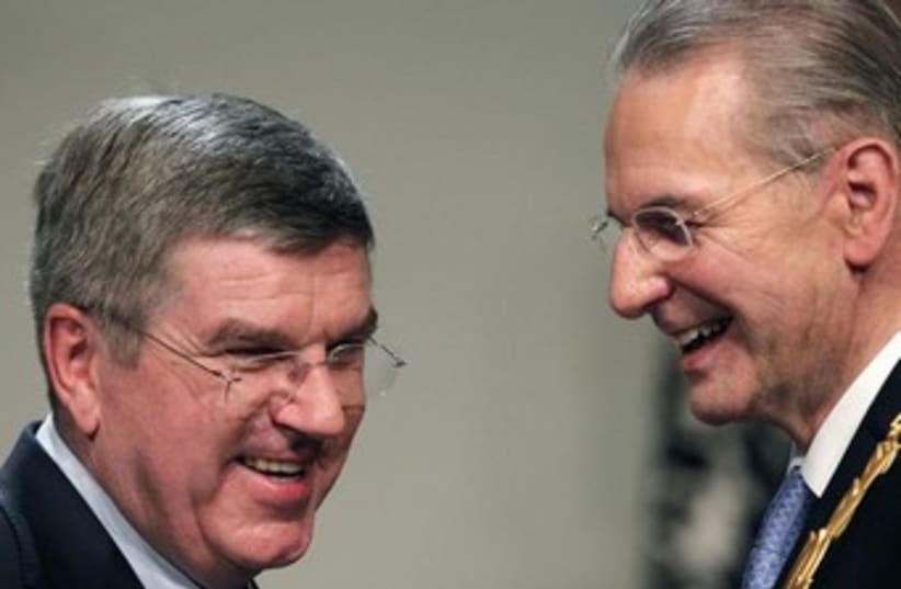Incoming IOC chief Thomas Bach and Jacques Rogge 370 (photo credit: Reuters)