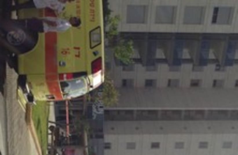 Building where man jumped off with 2 kids 370 (photo credit: Magen David Adom spokesman)