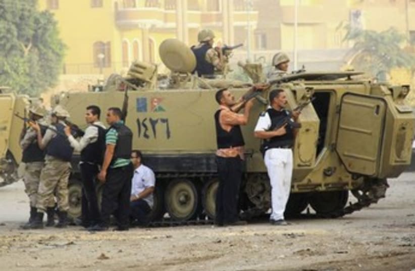Egyptian security forces at Kerdasa clashes (photo credit: Reuters)