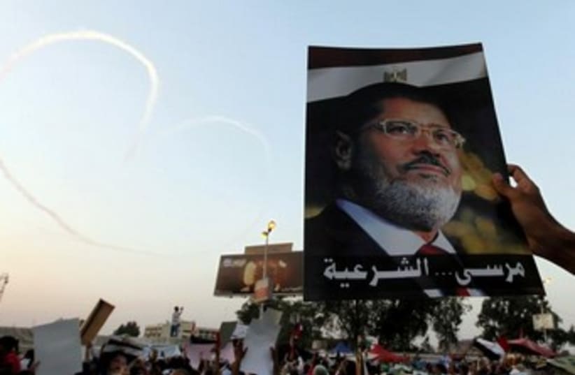 Morsi poster 370 (photo credit: REUTERS/Mohamed Abd El Ghany)