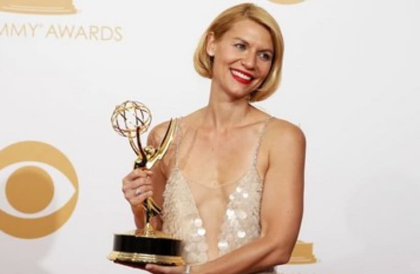 Claire Danes 'Homeland' poses backstage at Emmy Awards (photo credit: REUTERS/Lucy Nicholson)