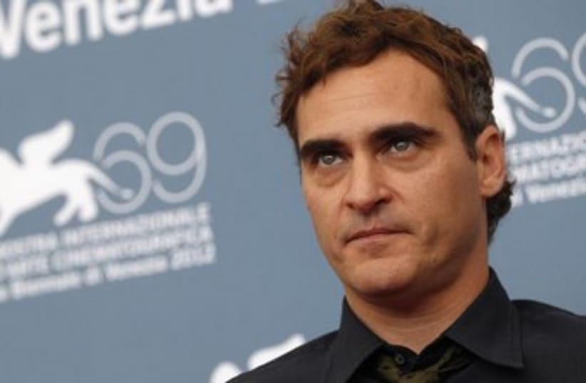 US actor Joaquin Phoenix poses during a photocall  (photo credit: Reuters)
