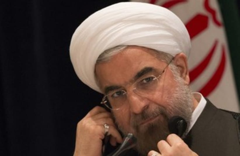 Rouhani on the phone 370 (photo credit: REUTERS)