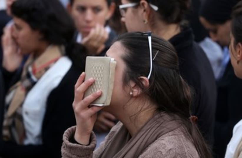 Woman praying at Kotel face in book 370 (photo credit: Marc Israel Sellem)