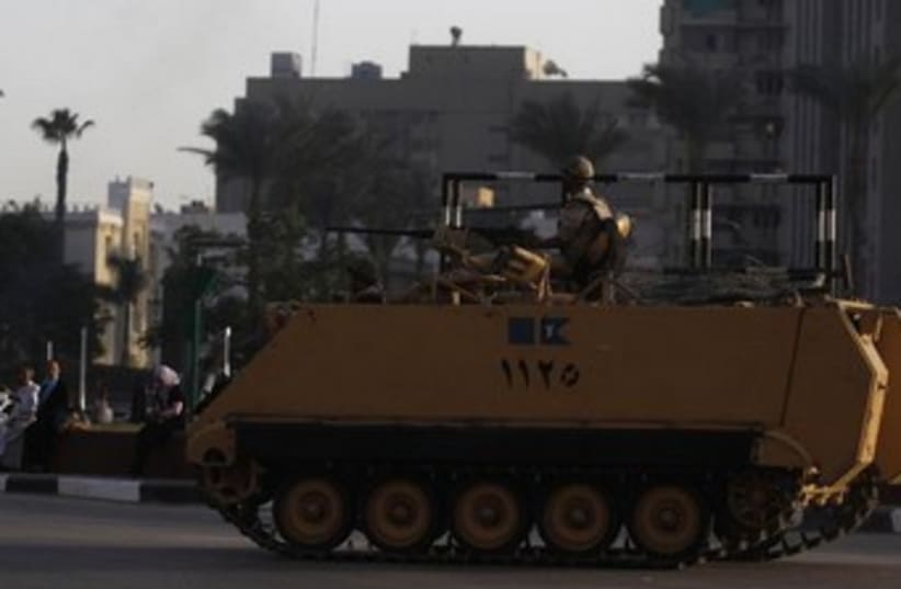 An Egyptian armored personnel carrier on alert in Cairo 370 (photo credit: Reuters)