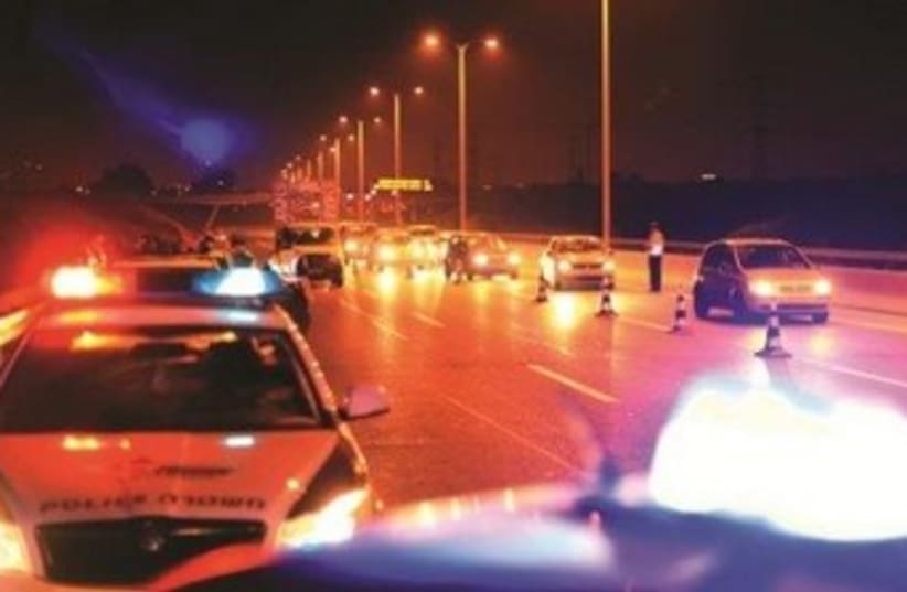 Police cars at night 370 (photo credit: Courtesy Israel Police)