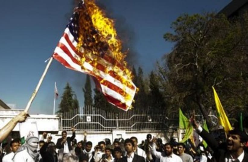 Iranian students burn US flag 370 (photo credit: REUTERS)