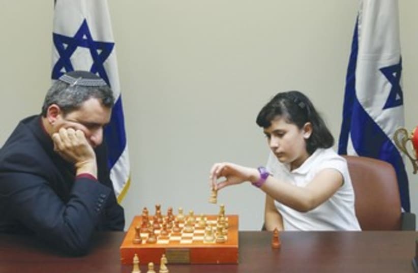 Elkin plays chess with little girl 370 (photo credit: Marc Israel Sellem/The Jerusalem Post)