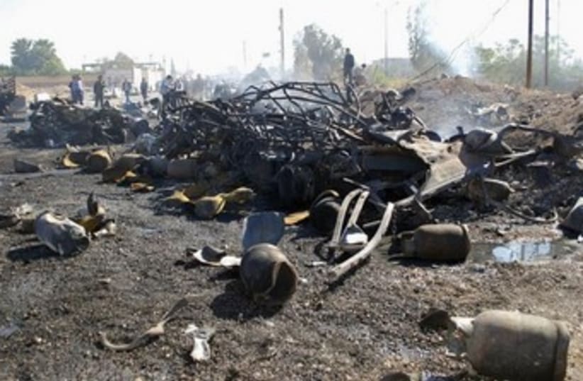 Debris from suicide bombing in Hama, Syria 370 (photo credit: REUTERS/SANA/Handout)