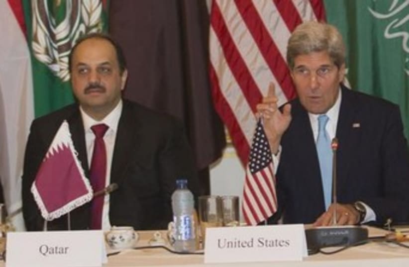 Qatari Foreign Minister Khalid Bin al Attiyah (L) and Kerry (photo credit: Reuters)