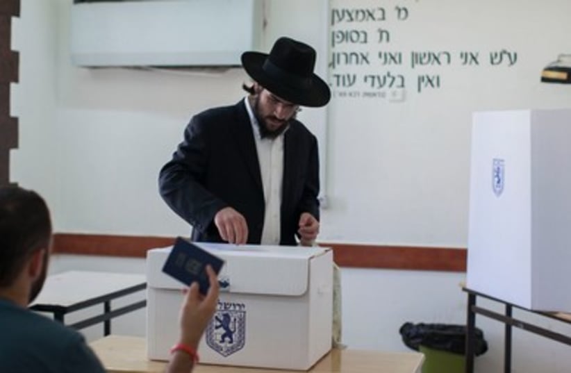 Haredi man voting 390 (photo credit: Marc Israel Sellem/The Jerusalem Post)