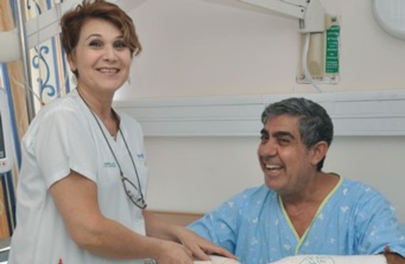 A nurse attends to Pini Levi at Kaplan Medical Center 370 (photo credit: Courtesy Kaplan Medical Center)