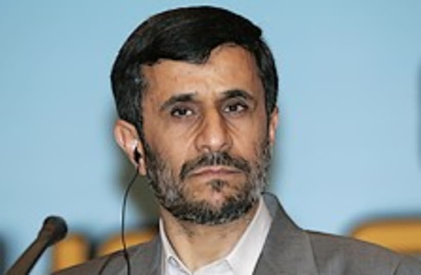ahmadinejad listens 224. (photo credit: AP)