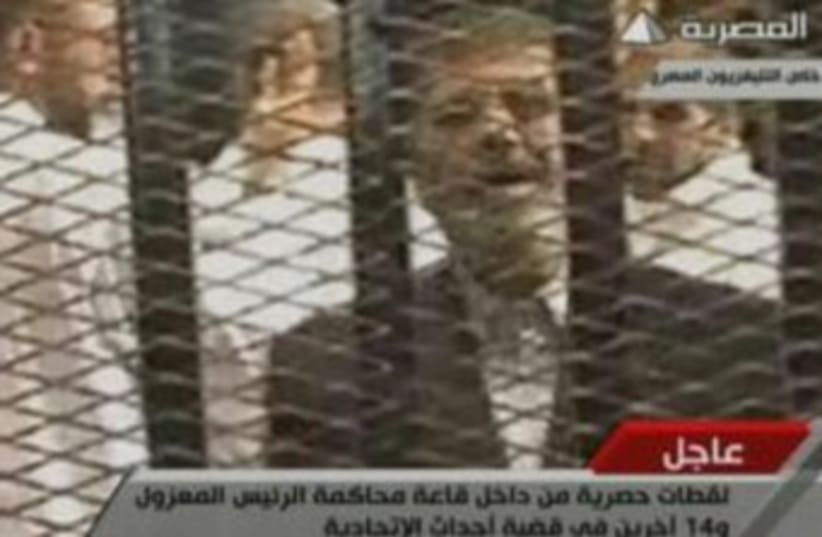 Morsi in first trial appearance 370 (photo credit: Screenshot)