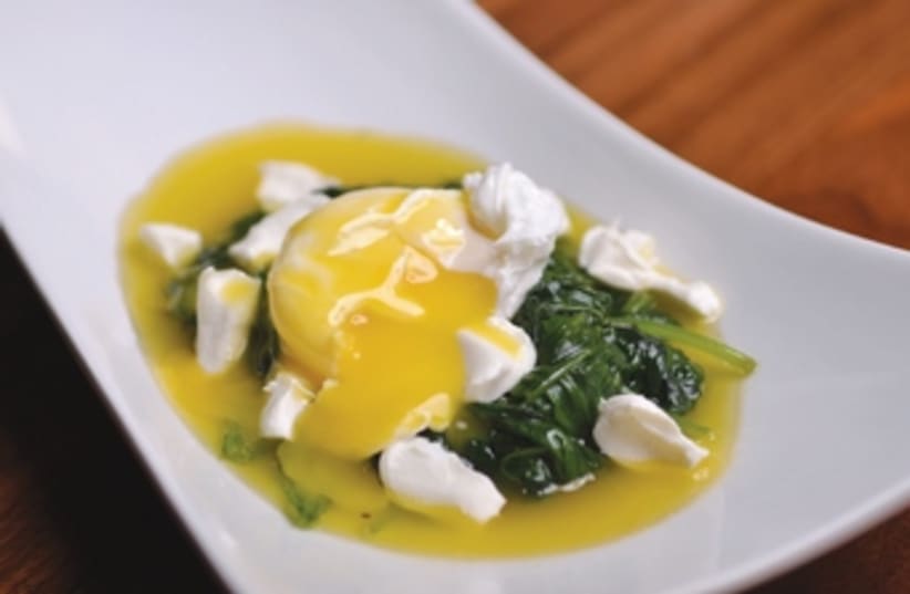 Poached egg on a bed of spinach and feta cheese (photo credit: Boaz Lavi)