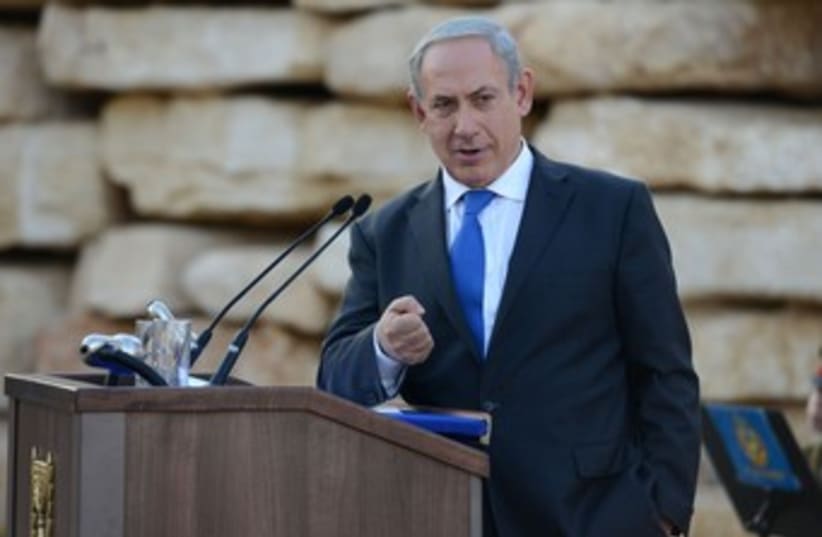 Netanyahu making fist looking at camera 370 (photo credit: Koby Gidon/GPO)