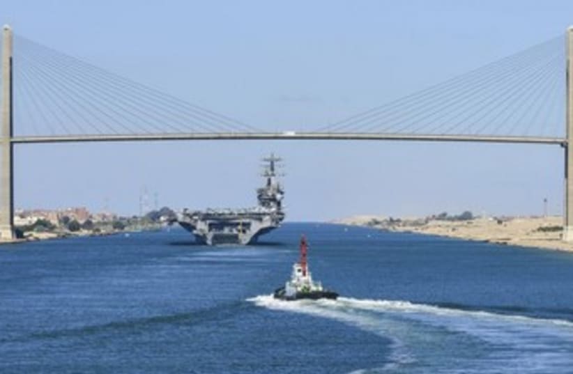 A US aircraft carrier in transit on the Suez Canal 370 (photo credit: REUTERS/US Navy/Mass Communication Specialist 3rd )