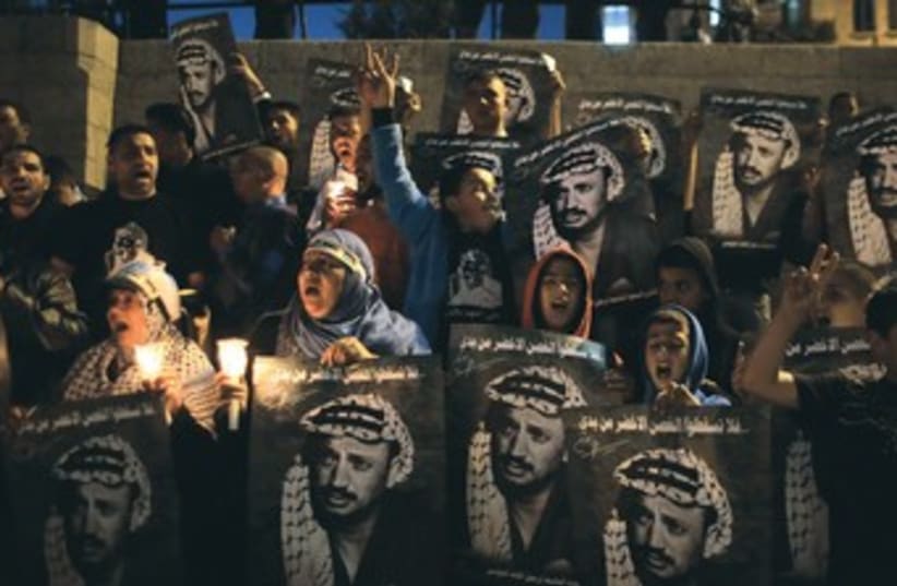 Palestinians hold Arafat rally 370 (photo credit: Ammar Awad/Reuters)
