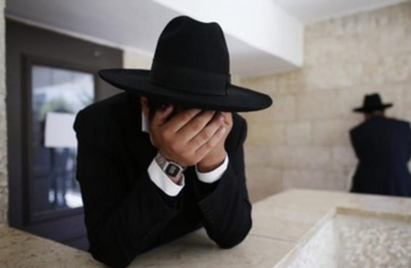 Ultra-orthodox man crying 370 (photo credit: REUTERS/Ronen Zvulun)