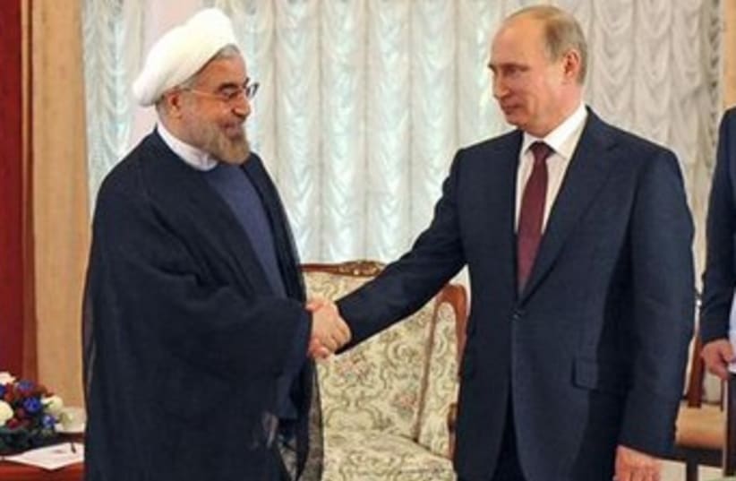 Russian Pres. Putin and Iranian Pres. Rouhani 370  (photo credit: REUTERS)
