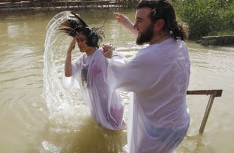 baptism ceremony Jordan river 370 (photo credit: Reuters)