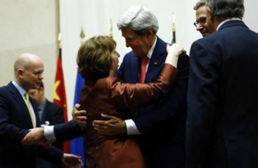 US Sec. of State Kerry hugs EU foreign policy chief Ashton37 (photo credit: Reuters)