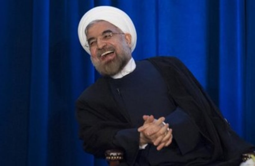 Rouhani laughing 370 (photo credit: REUTERS/Keith Bedford )