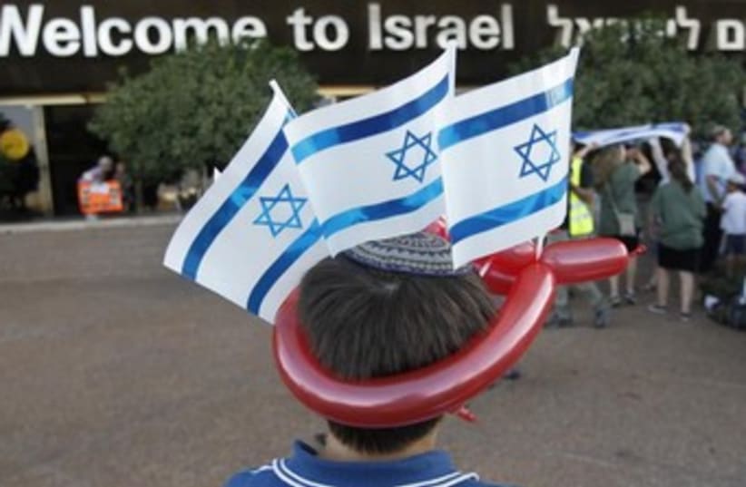Boy wearing Israeli flags 370 (photo credit: REUTERS)