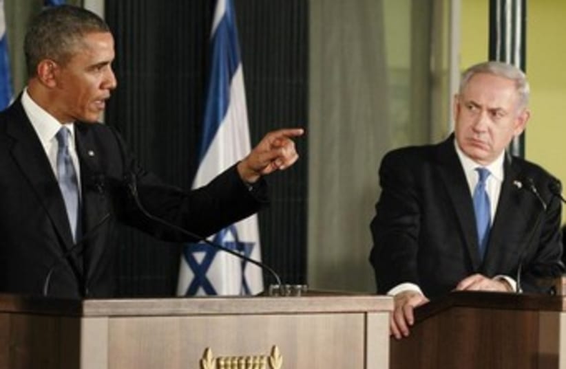 Netanyahu looks serious while Obama speaks 370 (photo credit: REUTERS/Jason Reed)