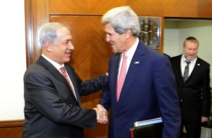 netanyahu and kerry shake hands 370 (photo credit: Matty Stern/U.S. Embassy Tel Aviv)