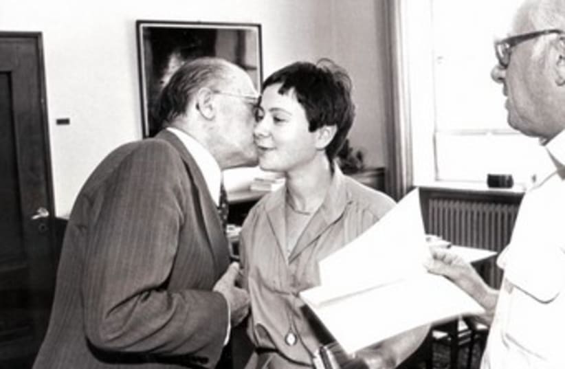 Sarah Honig gets a kiss from Prime Minister Menachem Begin (photo credit: Courtesy)
