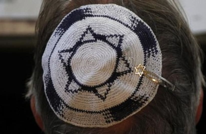 Head with Israeli flag kippa (photo credit: REUTERS/Ina Fassbender)