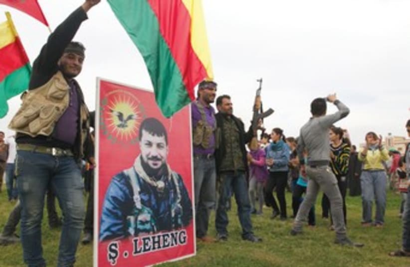 Kurds celebrate 370 (photo credit: Reuters)