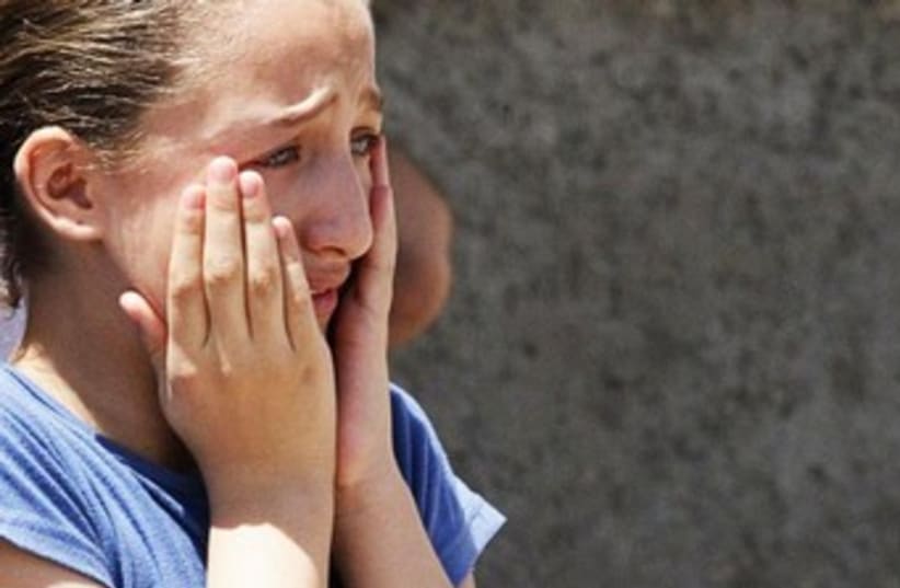 girl crying 370 (photo credit: reuters)