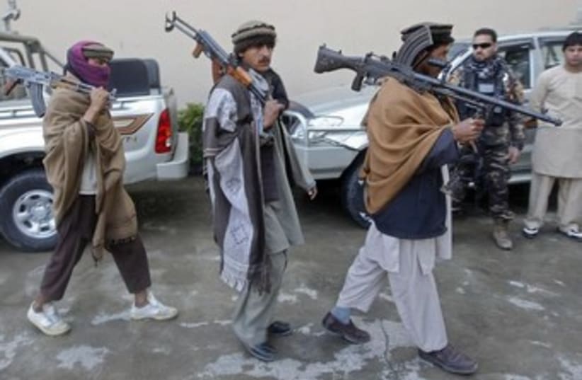 Taliban militants with weapons 370 (photo credit: REUTERS/Parwiz)
