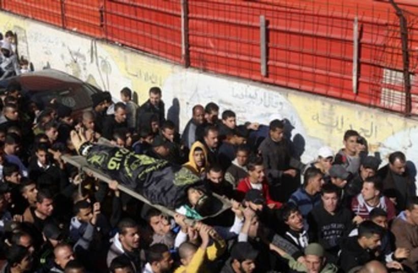 Jenin body carried to funeral (photo credit: Reuters)