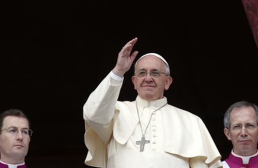 Pope Francis waves as he delivers first "Urbi et Orbi". (photo credit: REUTERS)
