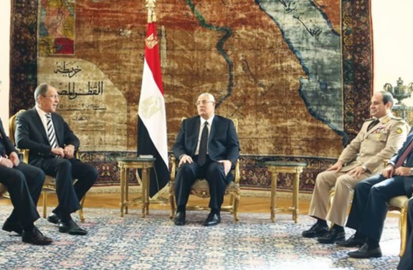 Egypt's interim President Mansour with Russia’s FM Lavrov. (photo credit: REUTERS)