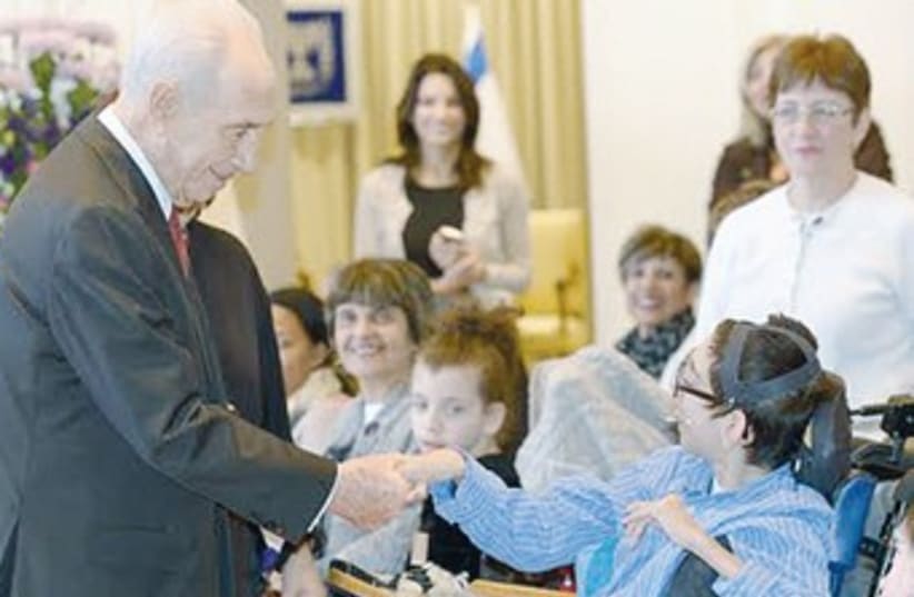 President Shimon Peres with youngsters from ILAN (photo credit: Mark Neiman/GPO)