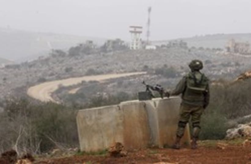 An IDF soldier monitors the Israel-Lebanon border. (photo credit: REUTER/Baz Ratner)