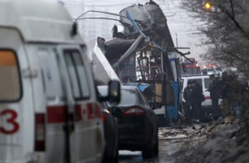 Authorities at the scene of an explosion in Volgograd (photo credit: Reuters)