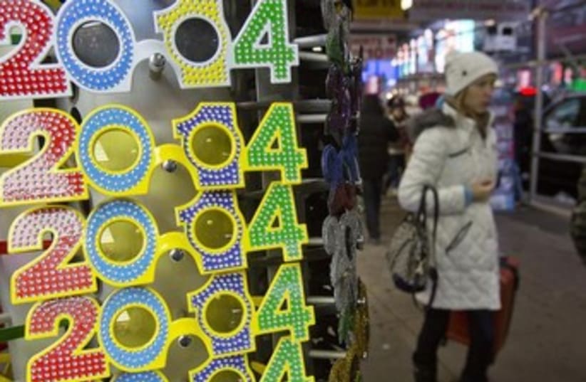 Rack of novelty glasses for New Year's Eve in New York City. (photo credit: Reuters)