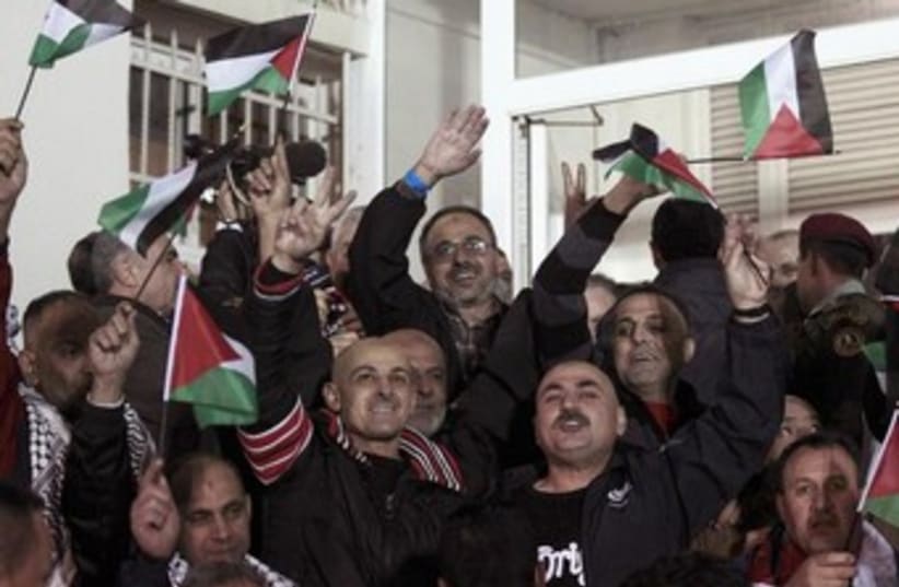 Celebrations in Ramallah as Palestinian prisoners released (photo credit: REUTERS/Ammar Awad)