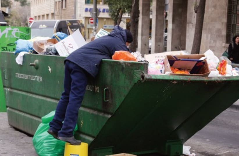 Citizens who rummage in the garbage is no longer uncommon. (photo credit: Marc Israel Sellem)
