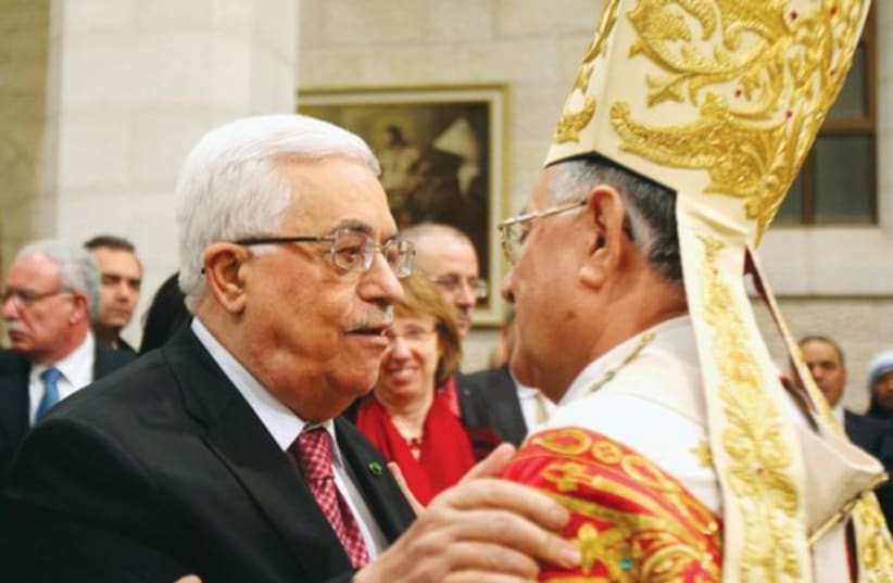Abbas greets Latin Patriarch of Jerusalem. (photo credit: REUTERS)
