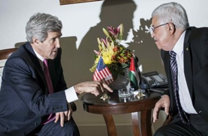 John Kerry and Mahmoud Abbas. (photo credit: Reuters)