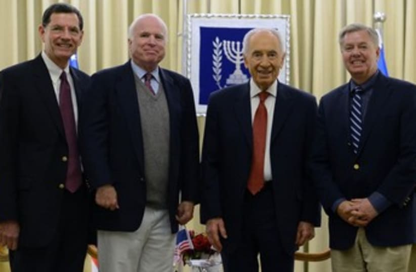 President Shimon Peres with US senators. (photo credit: Kobi Gideon/GPO)