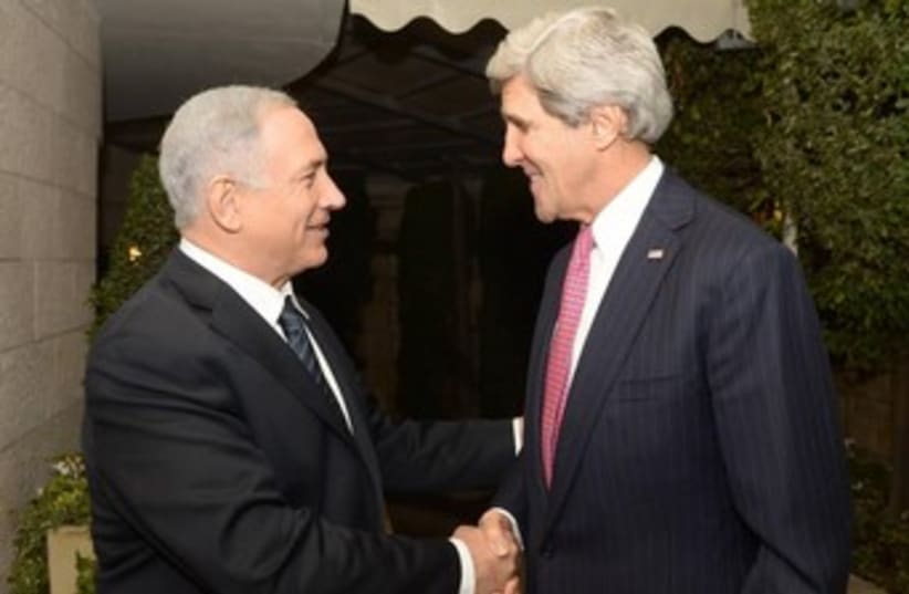US Secretary of State John Kerry and PM Binyamin Netanyahu. (photo credit: Amos Ben Gershon/GPO)