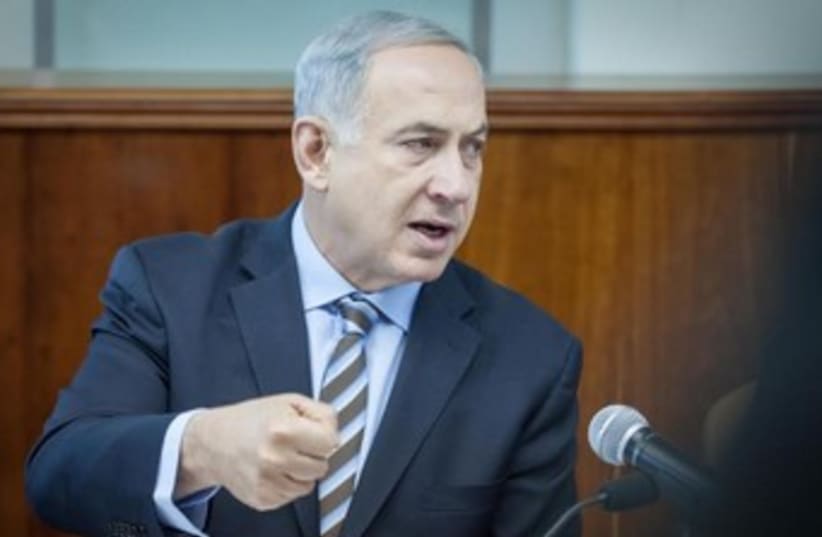 Prime Minister Binyamin Netanyahu at Sunday's cabinet meeting, January 5, 2014. (photo credit: Emil Salman/Pool/Haaretz)