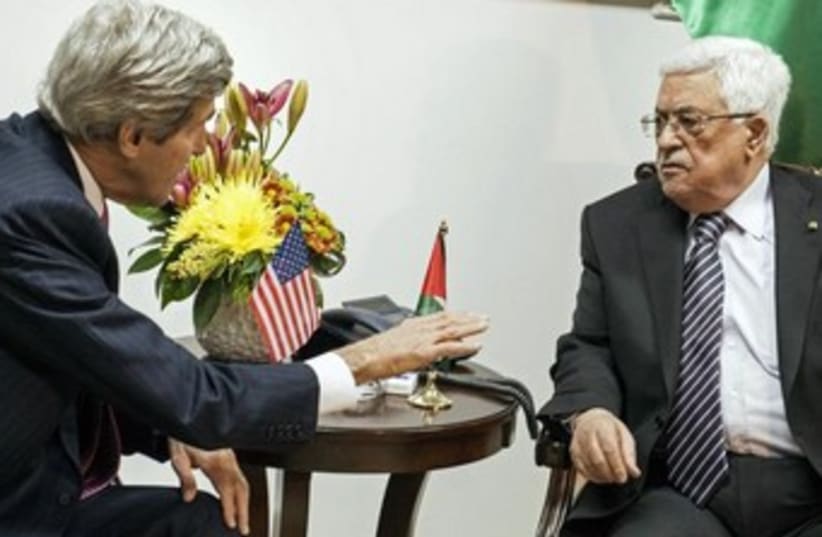 US Secretary of State John Kerry and PA President Mahmoud Abbas meeting in Ramallah, January 4, 2013. (photo credit: REUTERS/Brendan Smialowski/Pool)